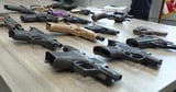 Numerous guns, drugs and thousands in cash found at Long Beach home, police say
